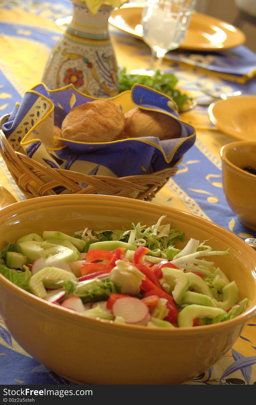 Fresh garden salad and homemade rolls.