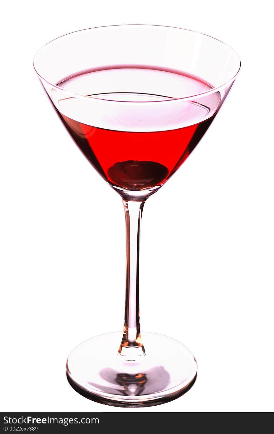 Martini glass with red coctail and cherry