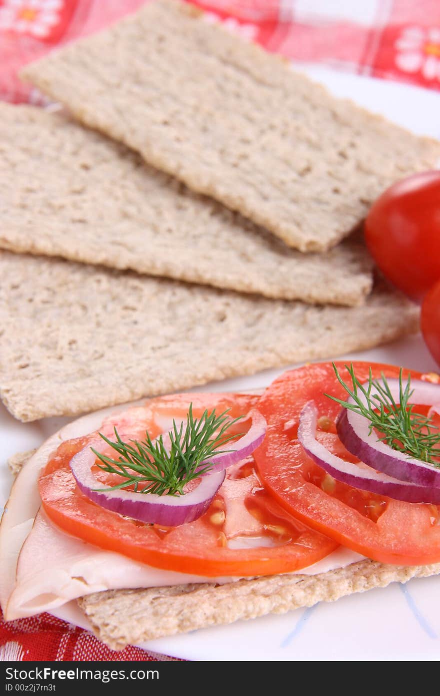 Crispy bread with ham, tomato and dill. Crispy bread with ham, tomato and dill