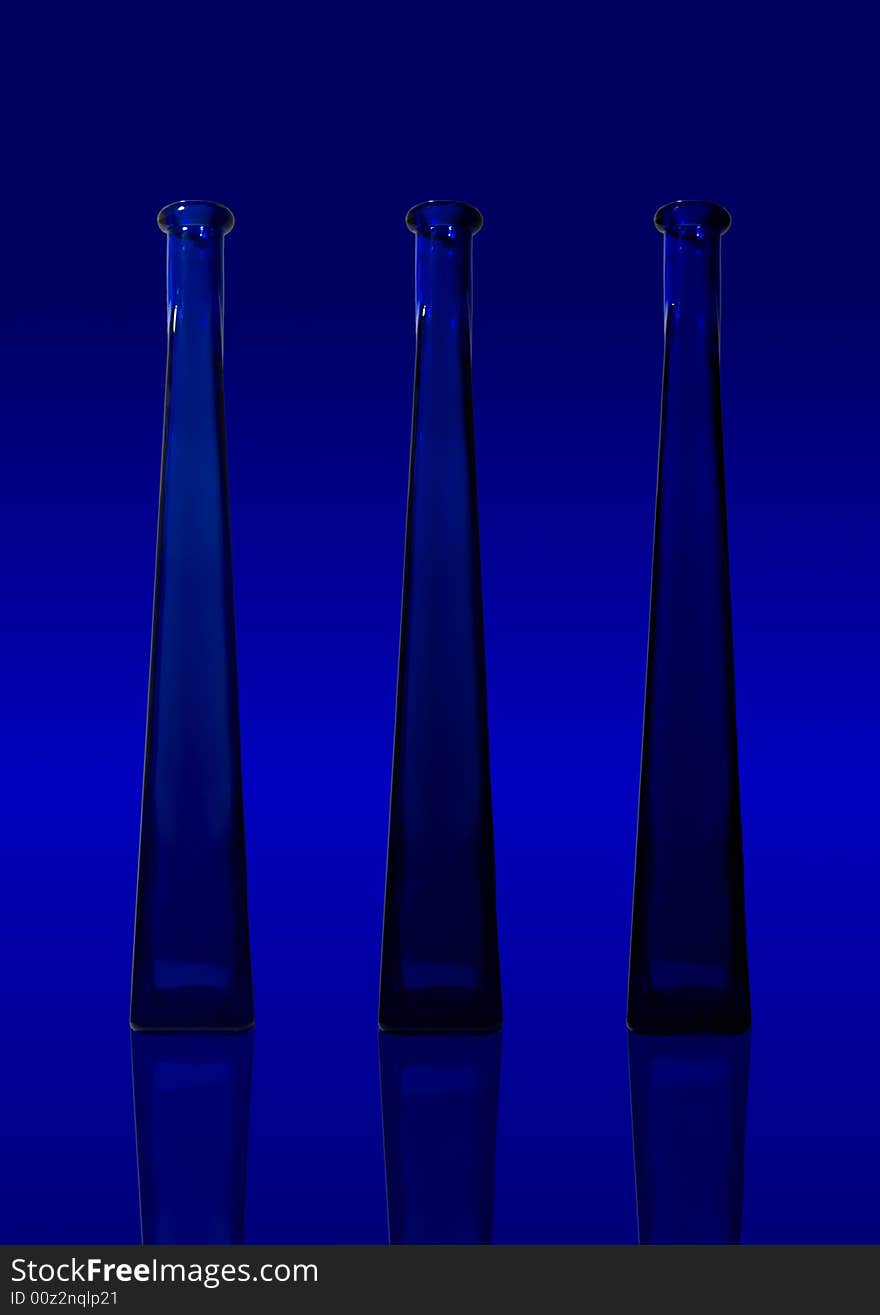 A photo composition of blue bottles