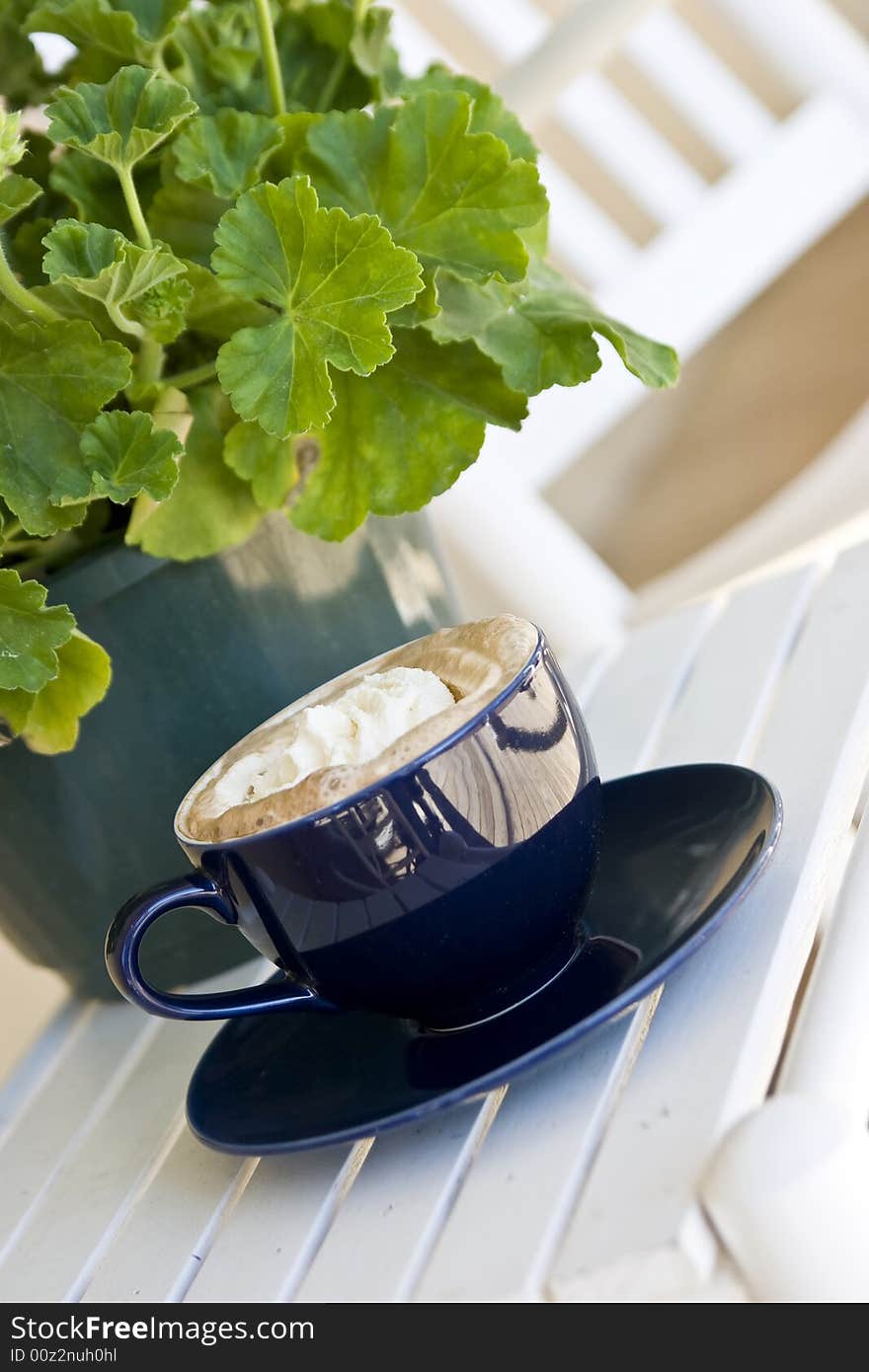 Cup of coffee outside on table at bistro