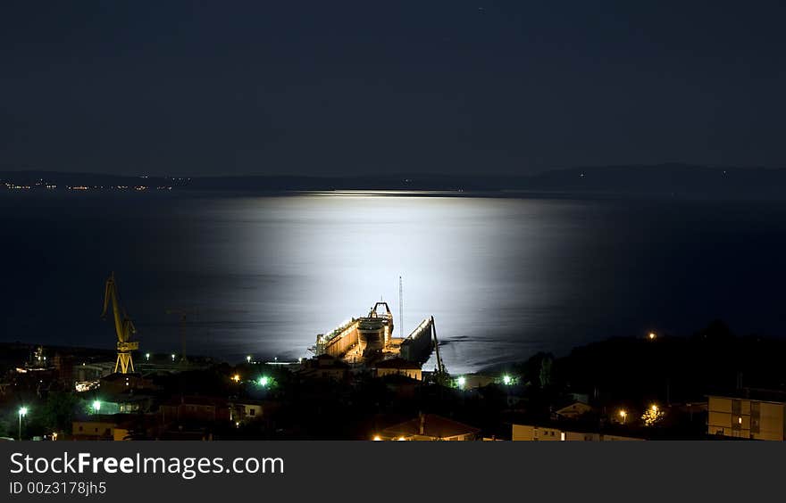 Shipyard dock view in moonlight. Shipyard dock view in moonlight