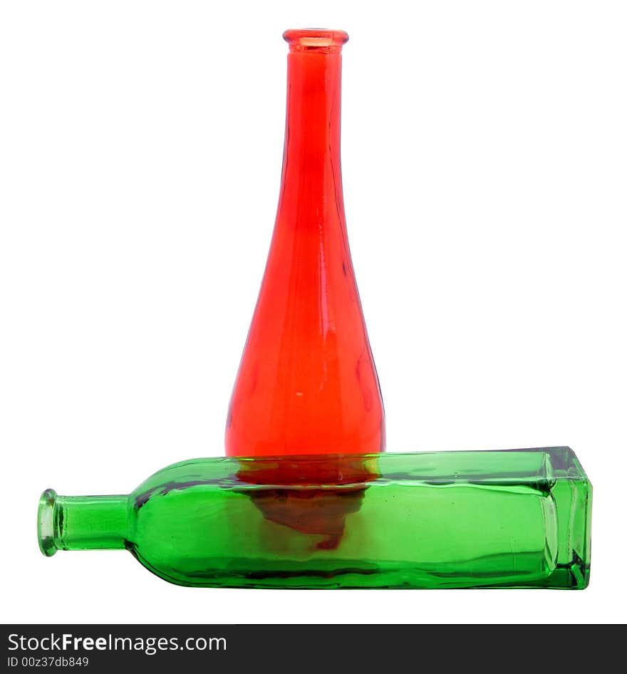 Red and green decorated bottles on white