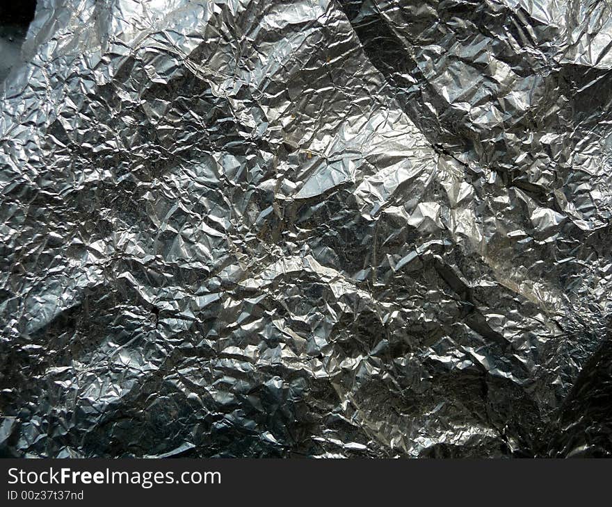 A photograph of some silver foil, it would make a interesting texture background. A photograph of some silver foil, it would make a interesting texture background.