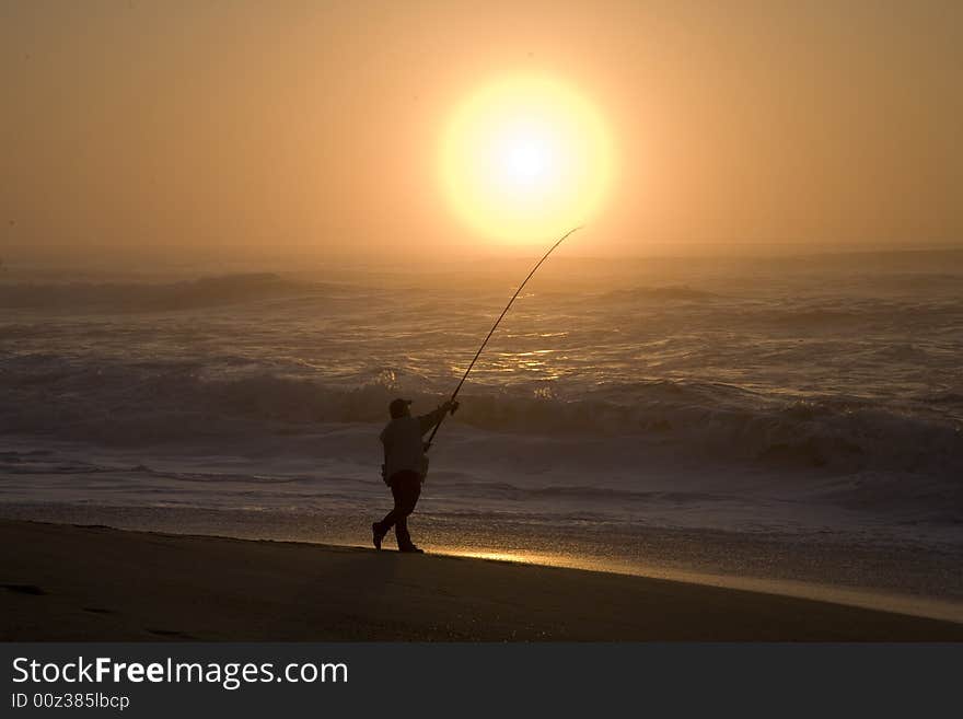 Fisherman In Sunset