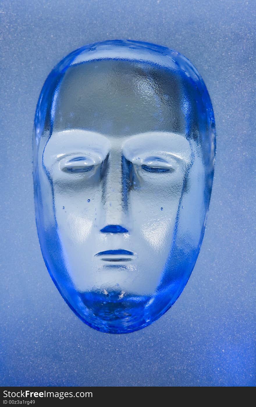 Human face in glass block