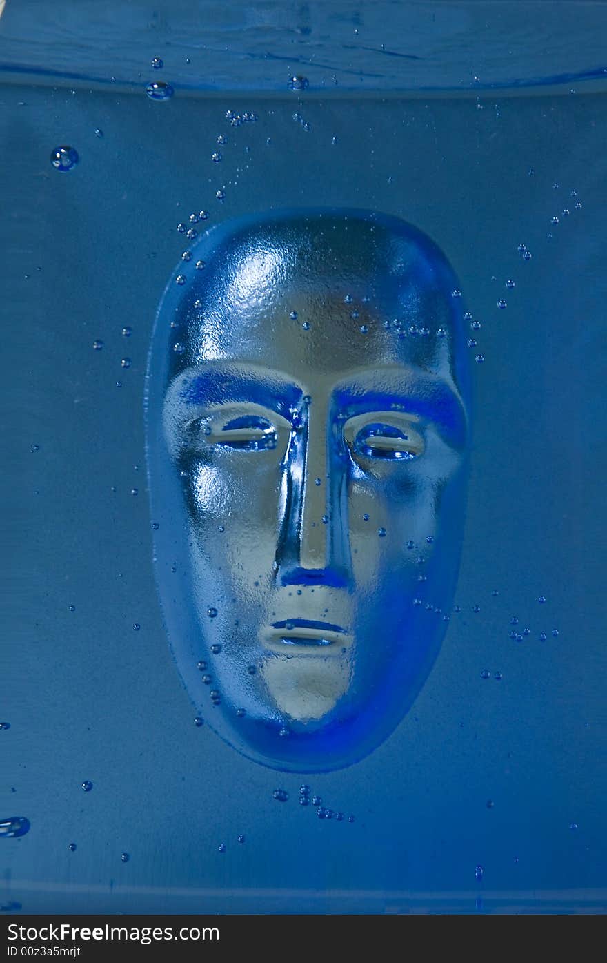 Human face in glass block