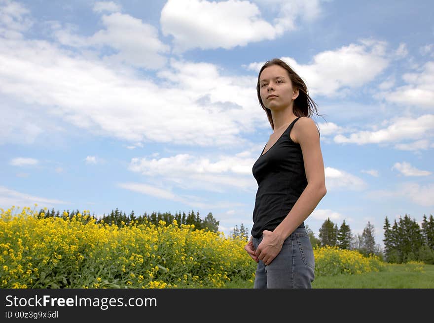 The woman on the sky  background. The woman on the sky  background