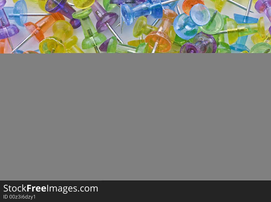 Colorful transparent push pins background. Colorful transparent push pins background