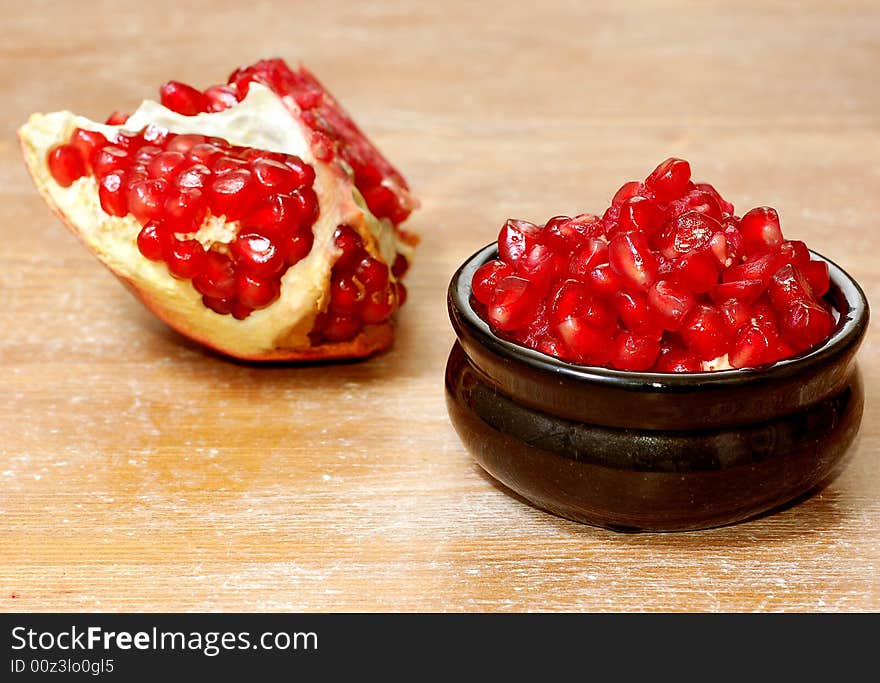 Broken ripe pomegranate fruit and seeds