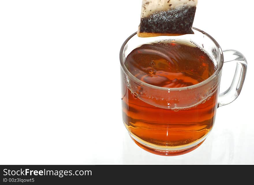 Transparent cup of tea with tea bag