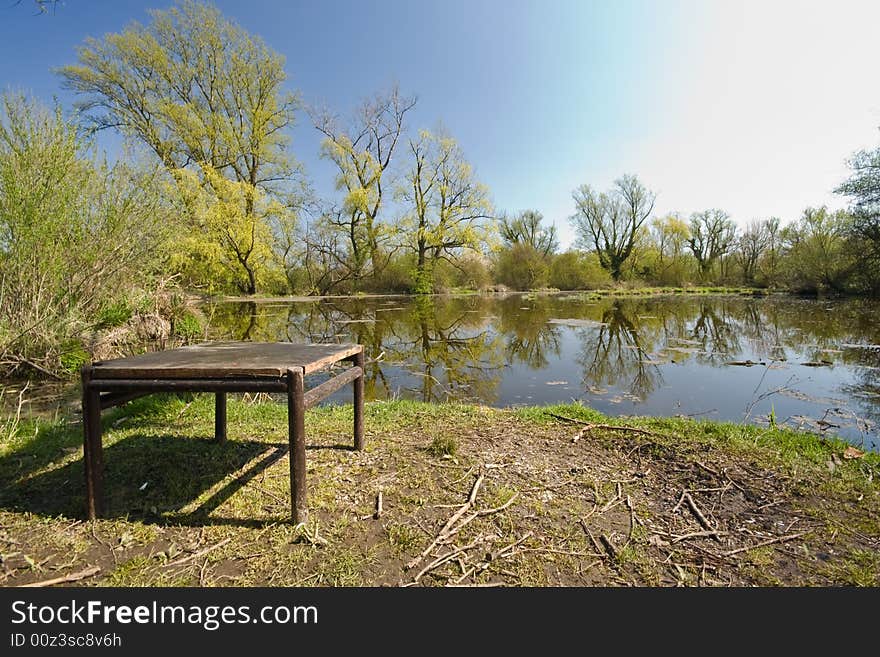 Table on lake coast