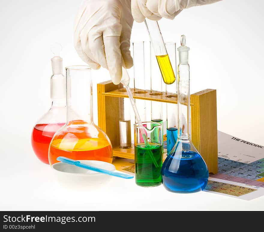 Various colorful glass laboratory ware on a white background. Various colorful glass laboratory ware on a white background