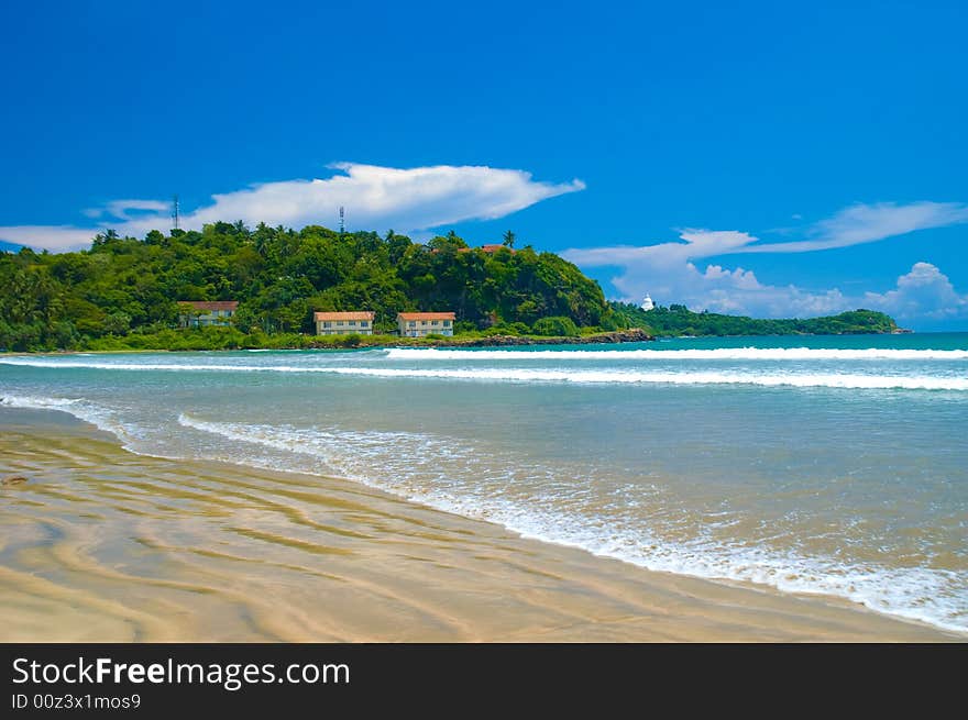 Wavy sand on the tropical beach