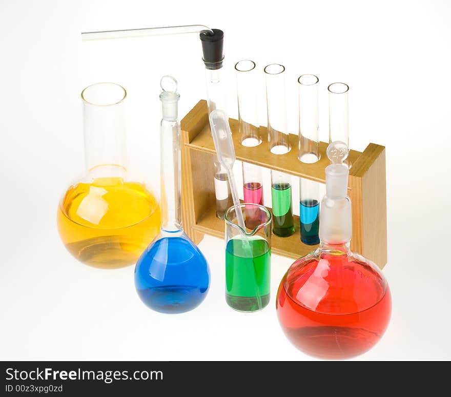 Various colorful glass laboratory ware on a white background. Various colorful glass laboratory ware on a white background