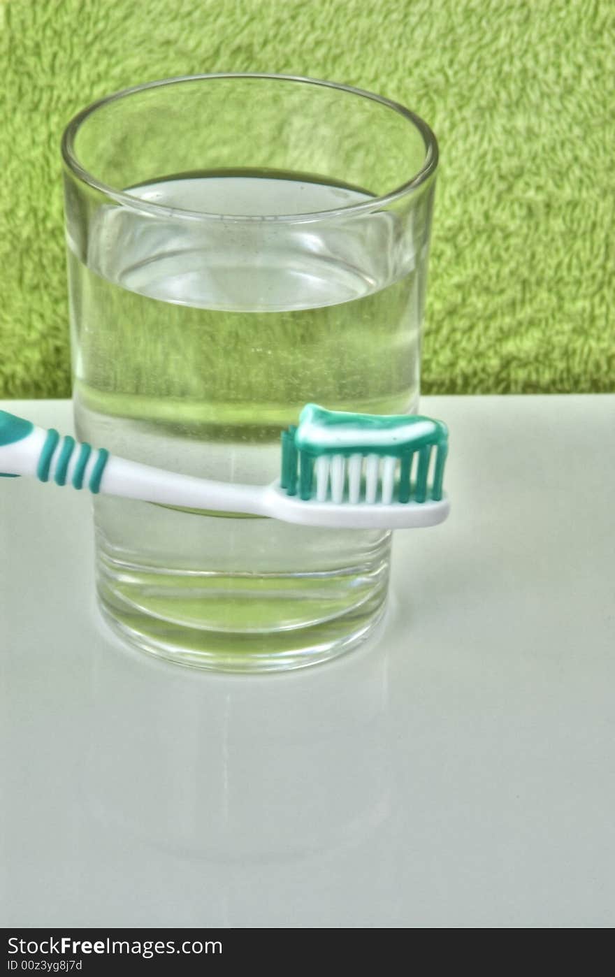 Dental brush and glass of water