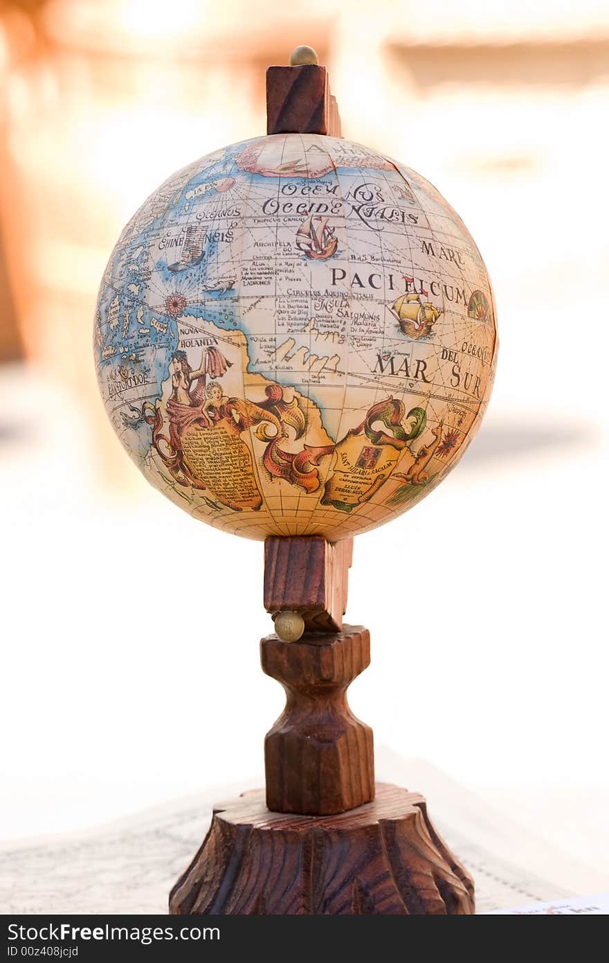 Old globe on wooden display stand