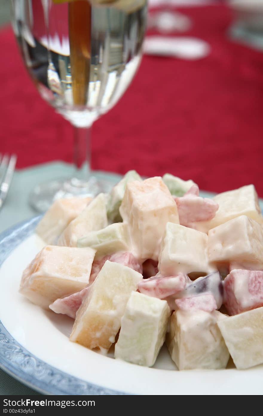 Appetizing salad on a plate with cup of drinking. Close up