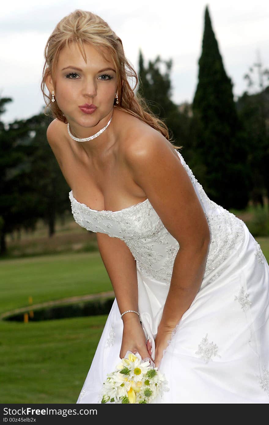 A bride blowing a kiss to camera. A bride blowing a kiss to camera