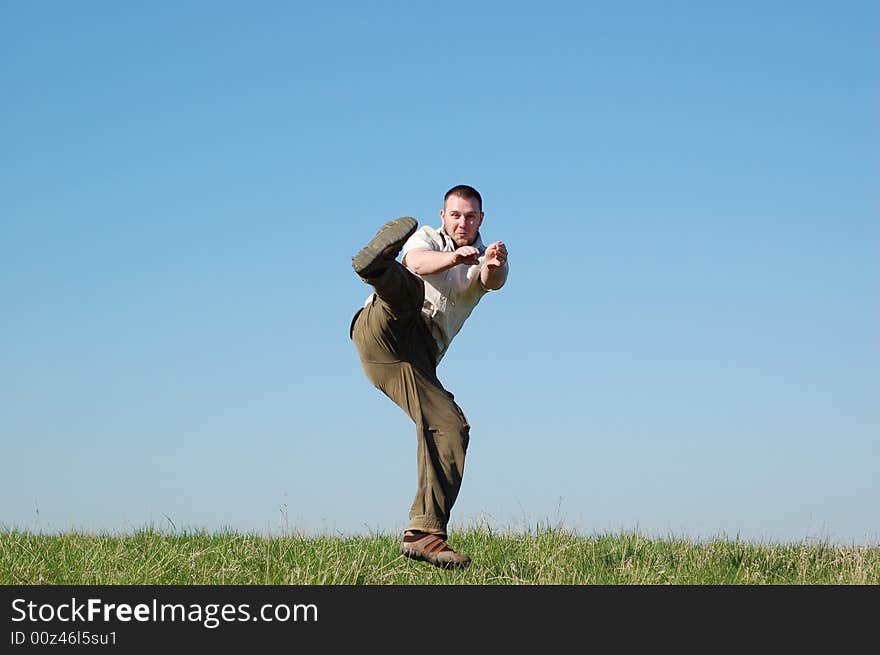 Active man on green meadow. Active man on green meadow