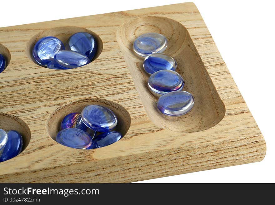 Wooden mancala game with blue stones