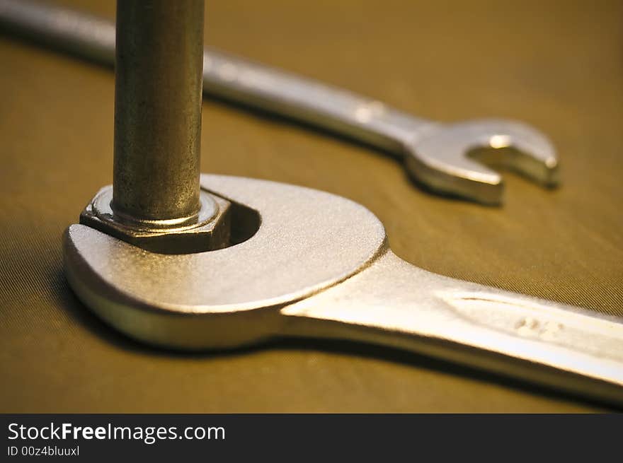 Close-up of a tool to a nut. Close-up of a tool to a nut