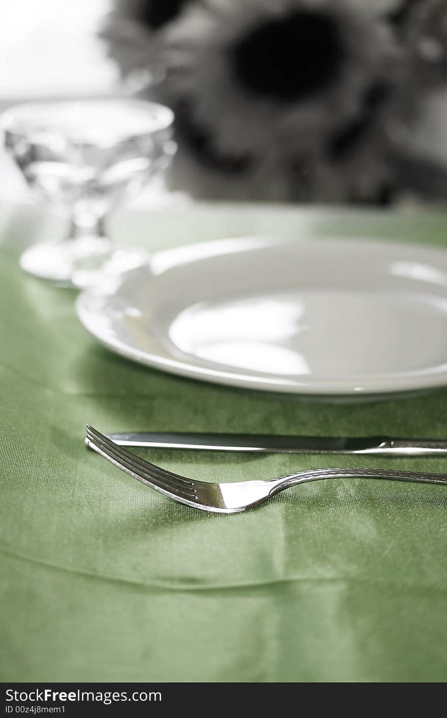 An upscale banquette table set for dinner