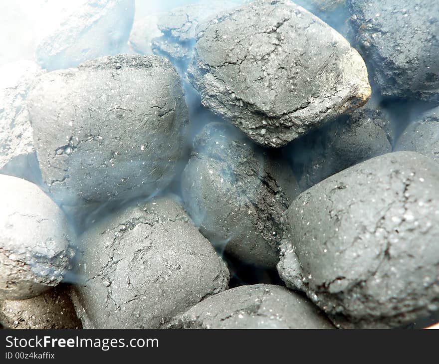 Close up view of smoldering charcoal for use in a barbecue grill. Close up view of smoldering charcoal for use in a barbecue grill.