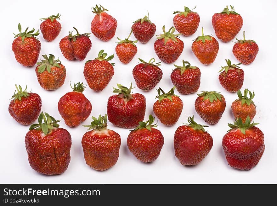 A lot of strawberries on white background. A lot of strawberries on white background