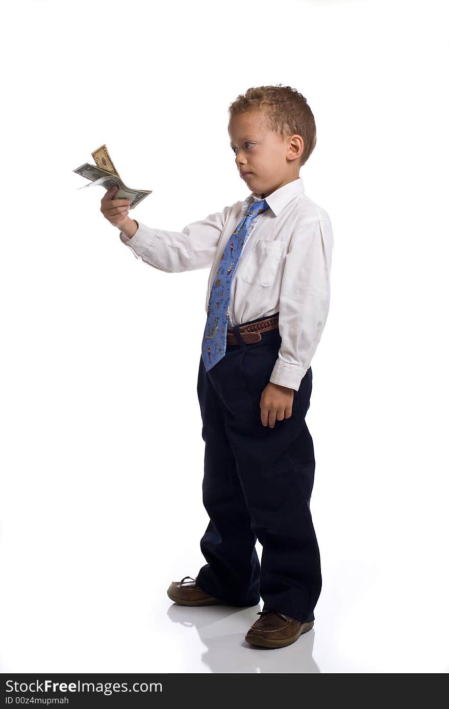 Young boy dressed as businessman holds money - isolated on white