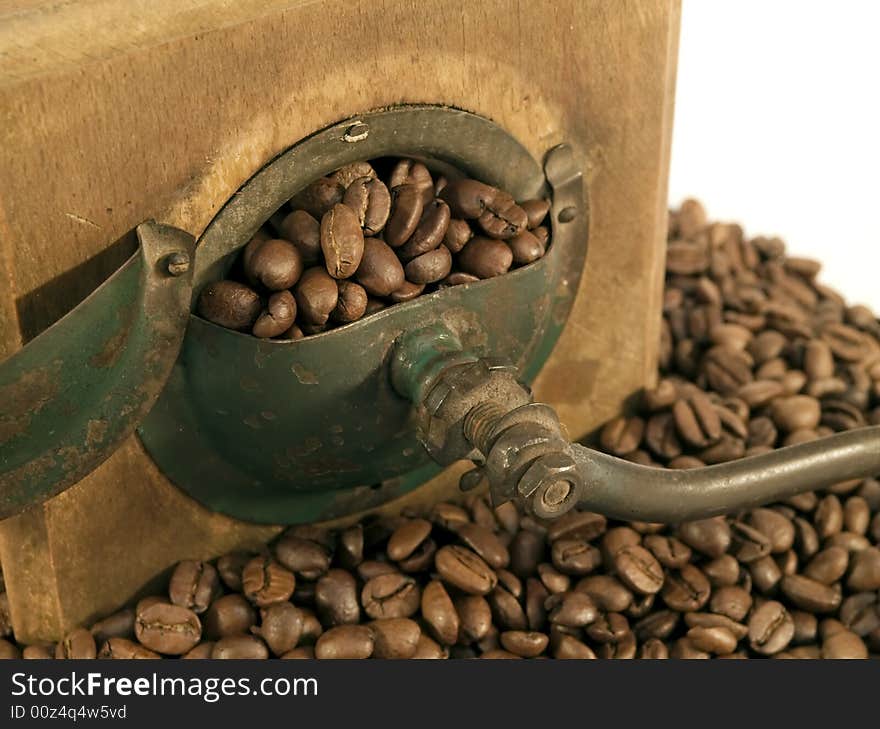 Old coffee mill with beans