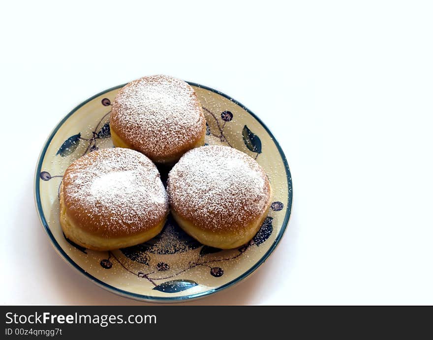 Bismarck with powdered sugar on dish