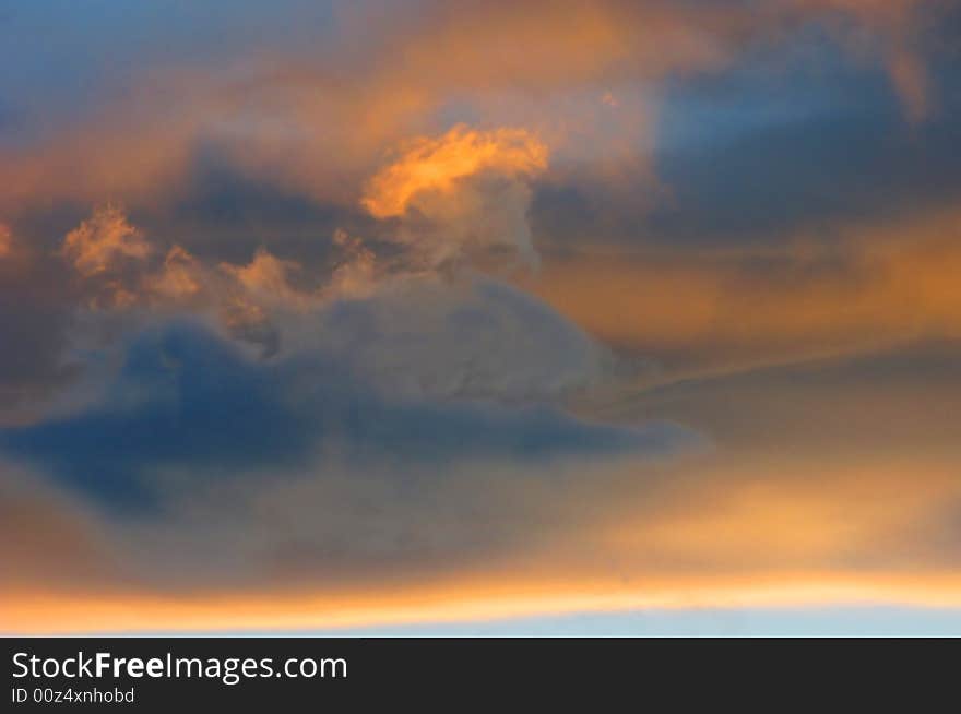 Setting sun has given the cloud formation a gentle and soothing texture and color. Setting sun has given the cloud formation a gentle and soothing texture and color