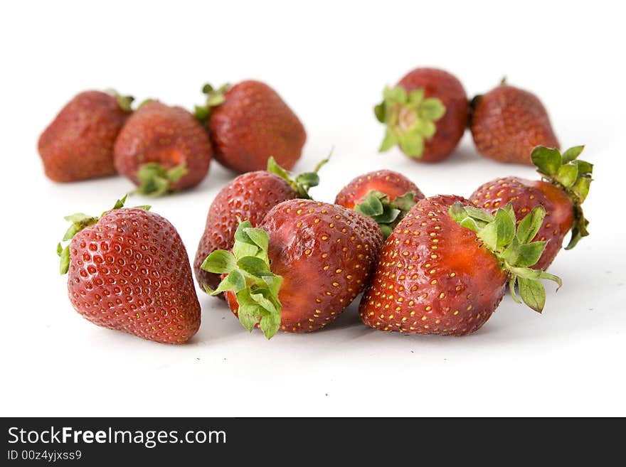 Some sweet strawberries isolated on white