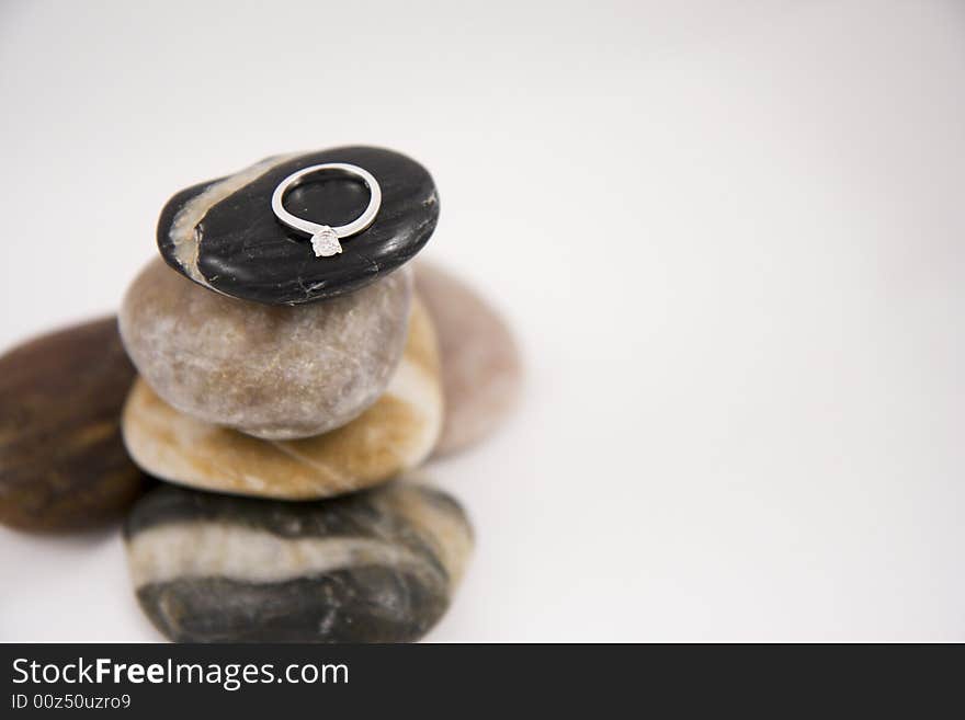 Diamond ring on top of pebbles. Diamond ring on top of pebbles