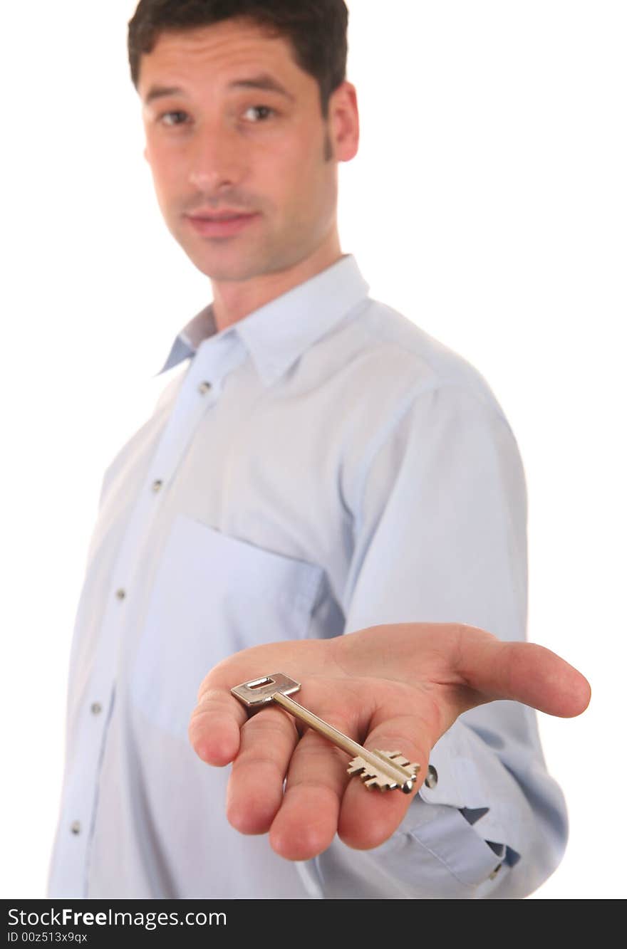 Businessman showing a key of a new house. Businessman showing a key of a new house