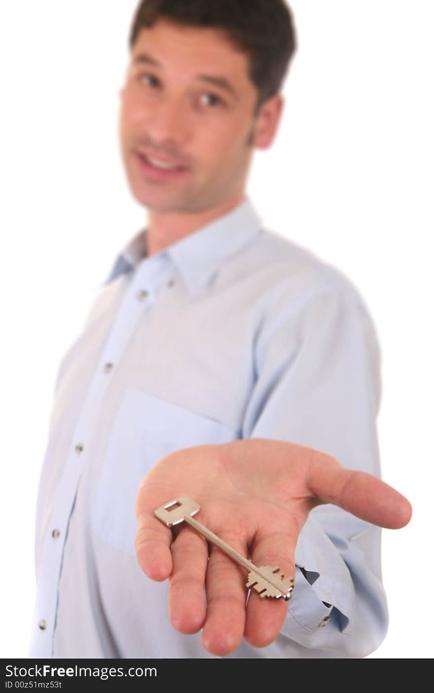 Businessman showing a key of a new house or flat