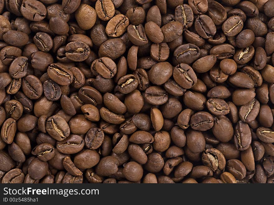 Coffee beans closeup. Astract background. Coffee beans closeup. Astract background.