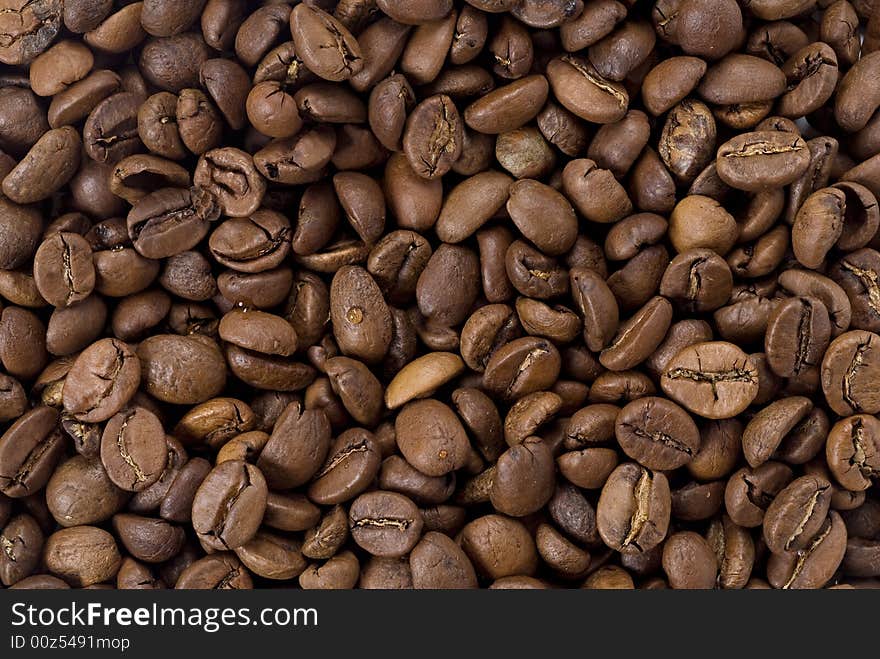 Coffee beans closeup. Astract background. Coffee beans closeup. Astract background.