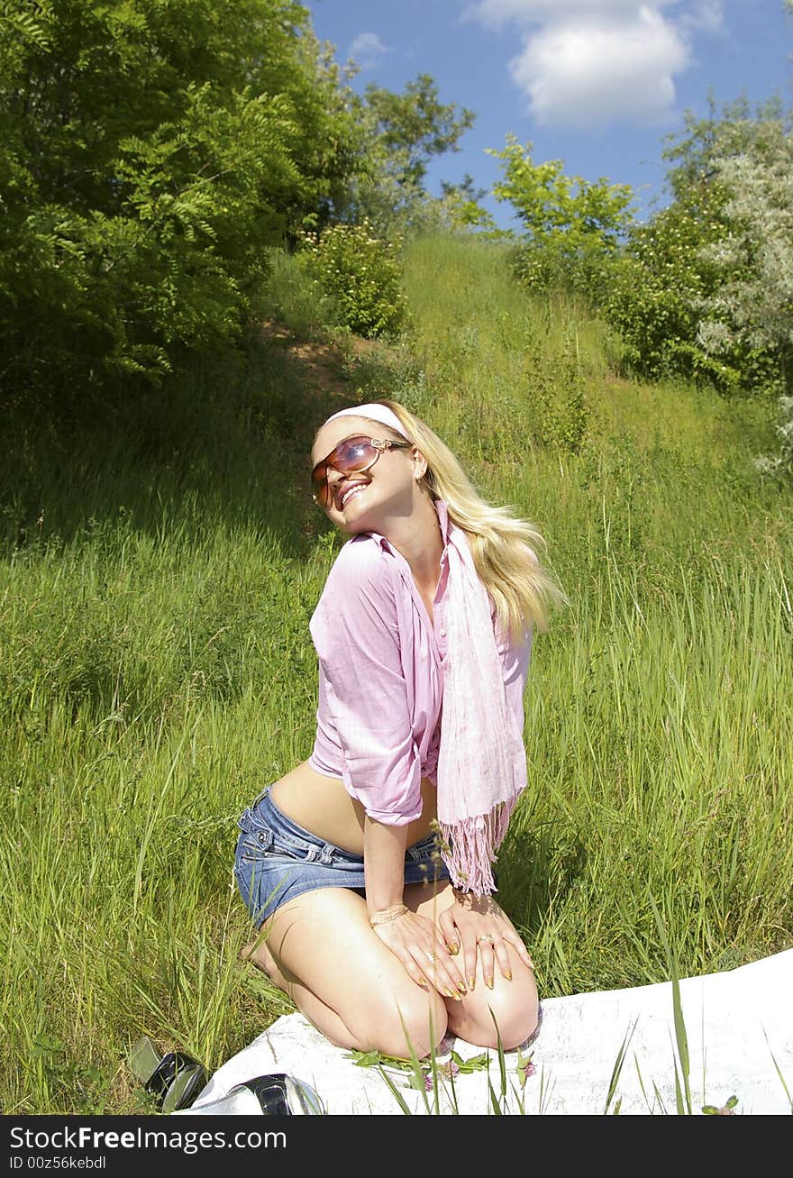 Beautiful girl looks at the map on nature. Beautiful girl looks at the map on nature