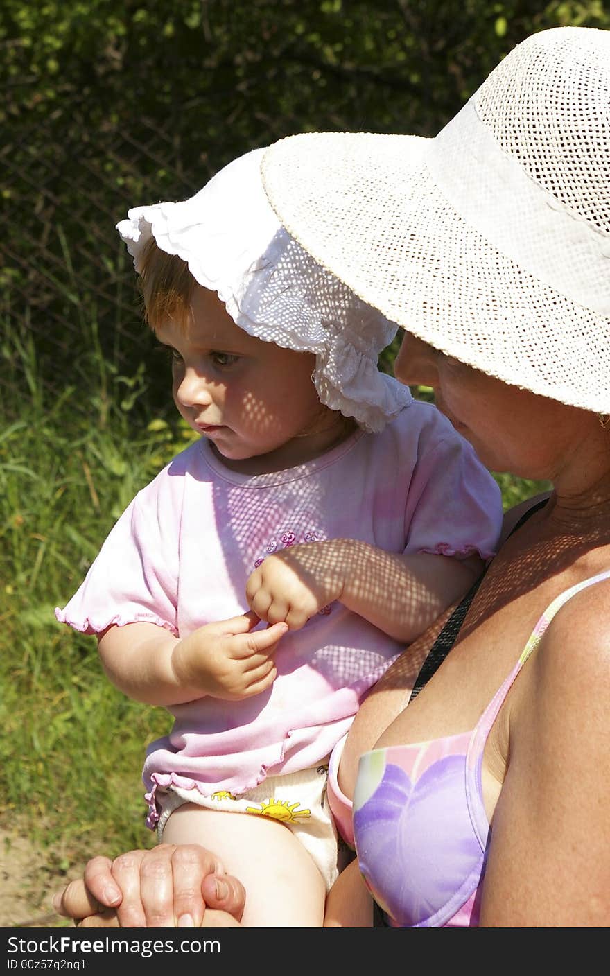 Grand Daughter And Grandmother In A Hat