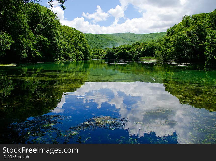 With reflections of cloud scape. With reflections of cloud scape