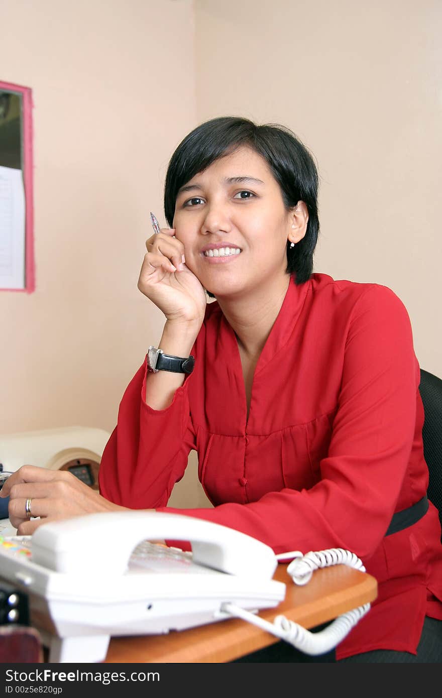 Asian business woman in red suit