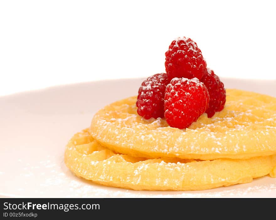 Plate of waffles with raspberries