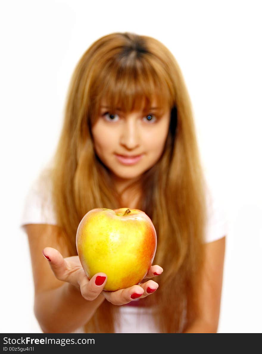 Beautiful young woman looking at apples.