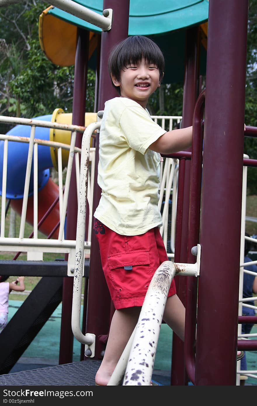 Boy standing on the slide