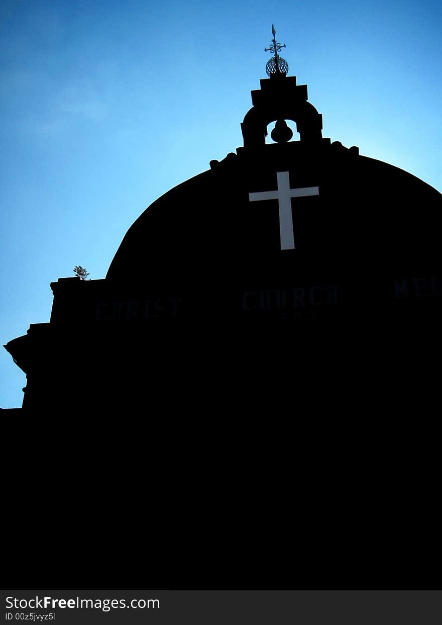 Asian Church, dark color building with blue sky background and low angle view.