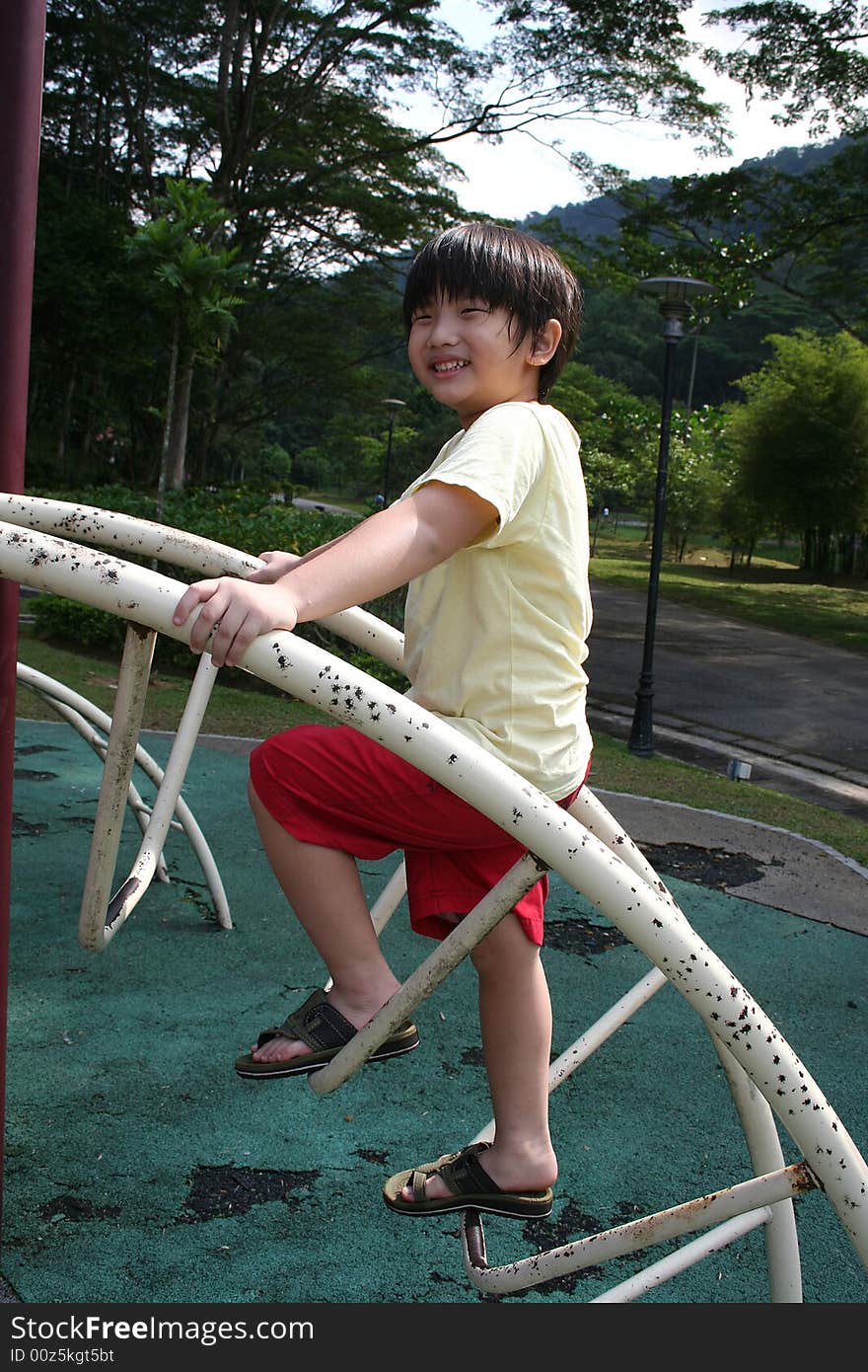 Boy climbing up slide