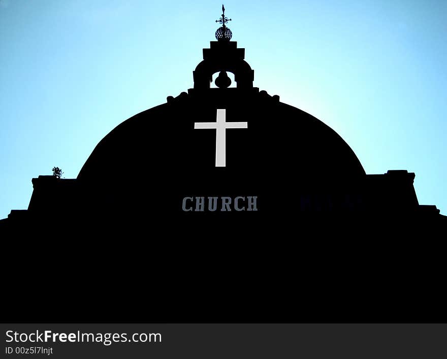 Asian Church, dark color building with blue sky background and low angle view.