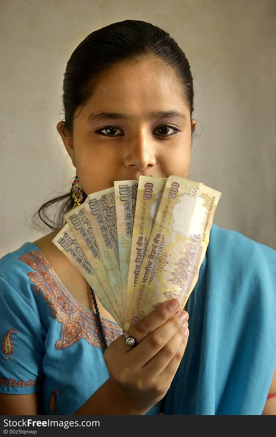 A woman holding currency.